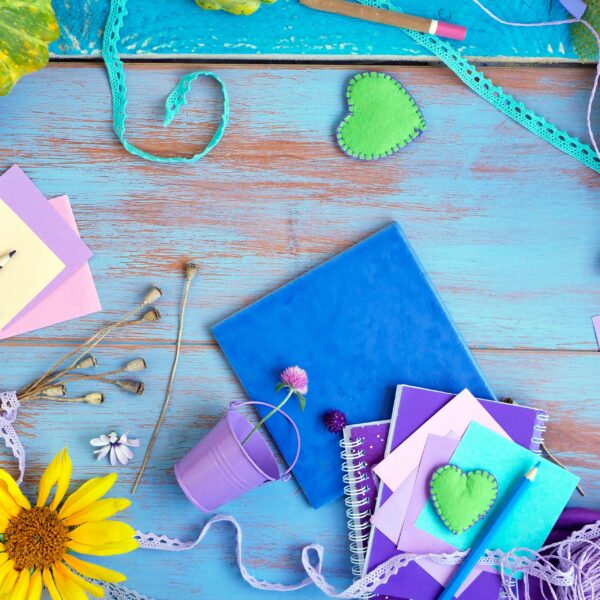 Decorative composition with a violet palette of hearts, flowers, artistic and stationery