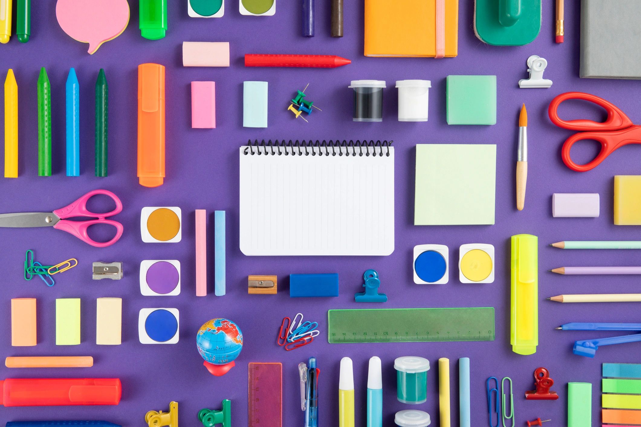 Colorful stationery flat lay with school and desk supplies